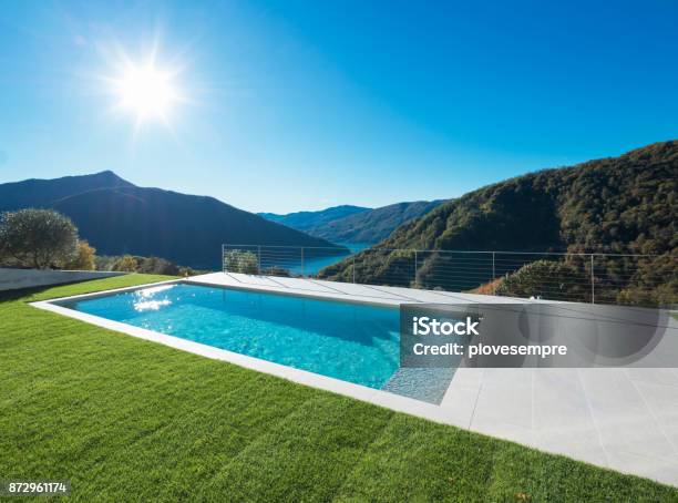 Modern Swimming Pool With Lake And Valley View Stock Photo - Download Image Now - Swimming Pool, House, Modern