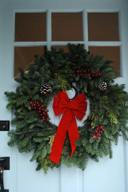 istock Christmas wreath on blue door 872961632