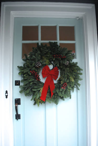istock Christmas wreath on blue door 872961636