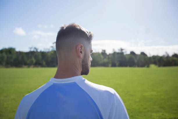 istock Football player standing in the ground 872966758