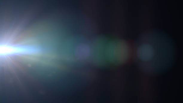istock bright and beautiful blue lens flare effect on black background, overlay texture 872973078