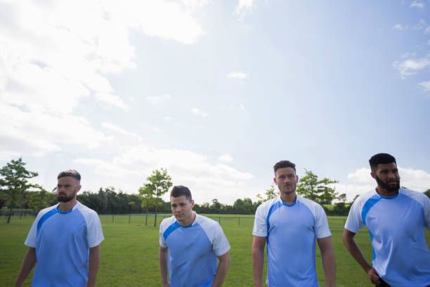 Football players standing in ready position