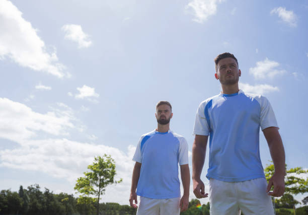 istock Football players standing in ready position 872979622