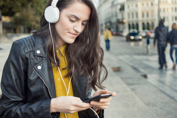istock Woman listening music 872980188