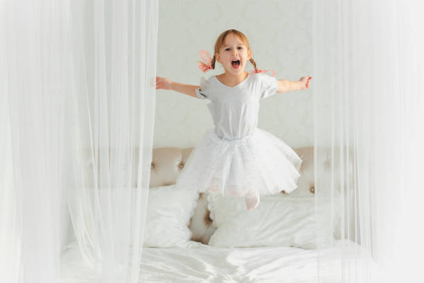 istock Little Girl and clock 872981760