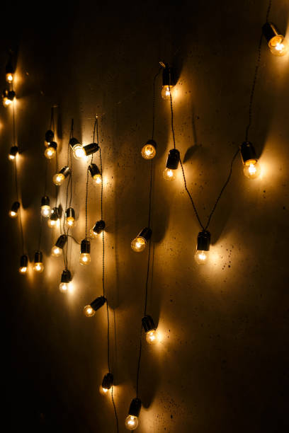 istock grlyanda electric lights on a dark wall 872983704