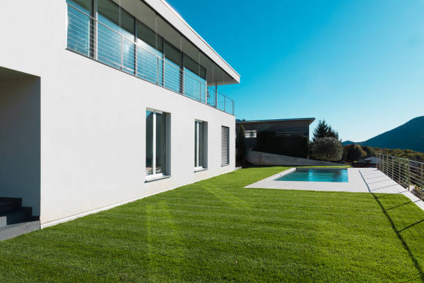 istock Modern white house with garden 872984926