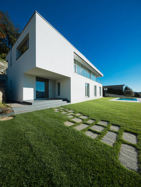 istock Modern white house with garden 872987594