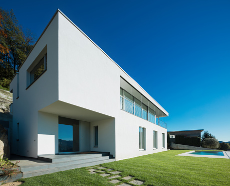 Modern white villa with garden