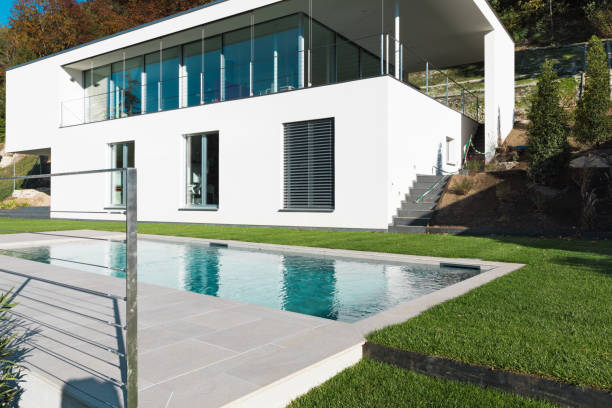 istock Modern white house with garden 872989348