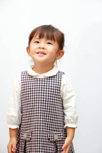 istock smiling Japanese girl (3 years old) (white back) 873000858