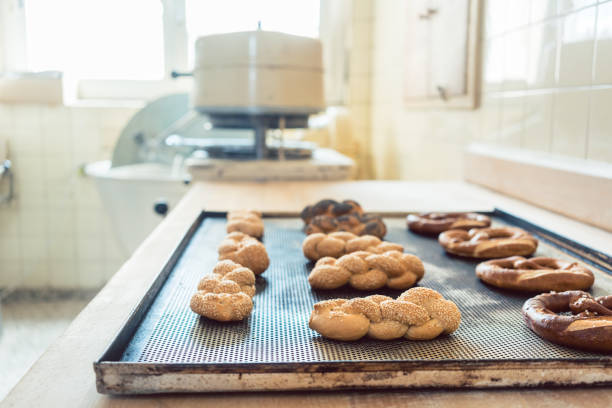 istock Bread rolls and pretzels on tray in bakery 873004074