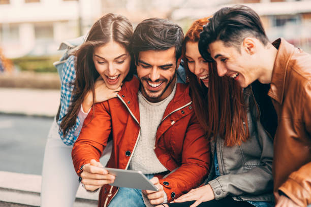 istock Friends using a tablet in the city 873004410
