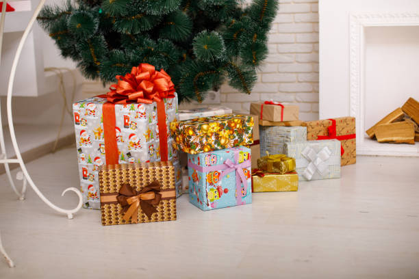 istock Close-up of Christmas presents under the Christmas tree. 873025104
