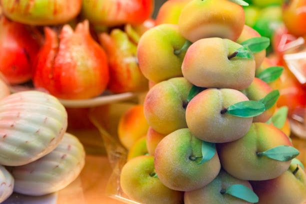 istock Cakes with marzipan in the form of peach. 873031168