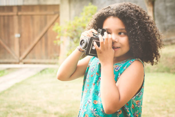 istock Cute girl taking a photo 873051012