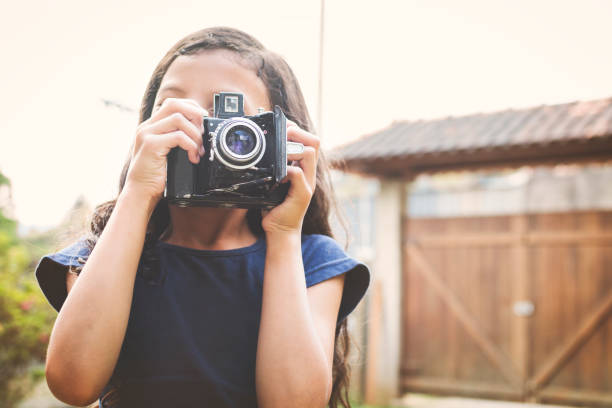 istock Cute girl taking a photo 873051306