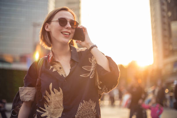 istock Woman talking on the mobile phone outdoors 873051606