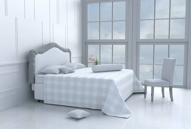 istock White bed room decorated with tree in glass vase, pillows, white blanket, Window, sky, Lamp,White wall it is pattern,chair, The sun shines through the window into the shadows,White floor.3d rendering. 873059318