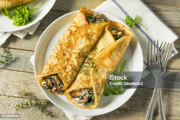 Savory Homemade Mushroom And Spinach Crepes Stock Photo - Download Image Now - Crêpe - Pancake, Pancake, Mushroom