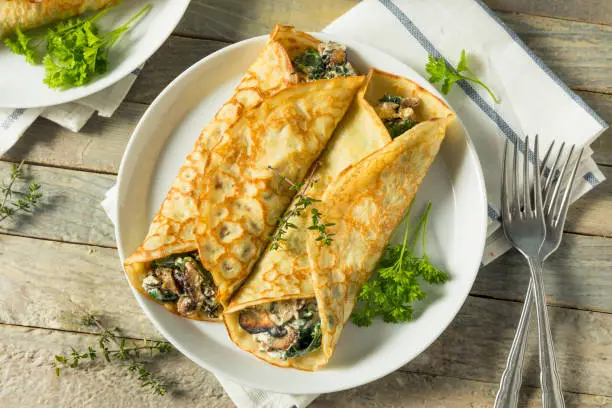 Savory Homemade Mushroom and Spinach Crepes with Cheese