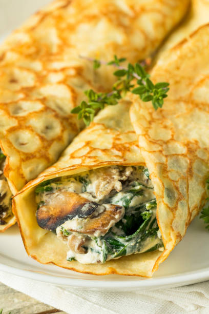 istock Savory Homemade Mushroom and Spinach Crepes 873072144