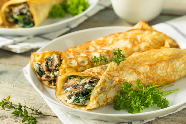 istock Savory Homemade Mushroom and Spinach Crepes 873072204