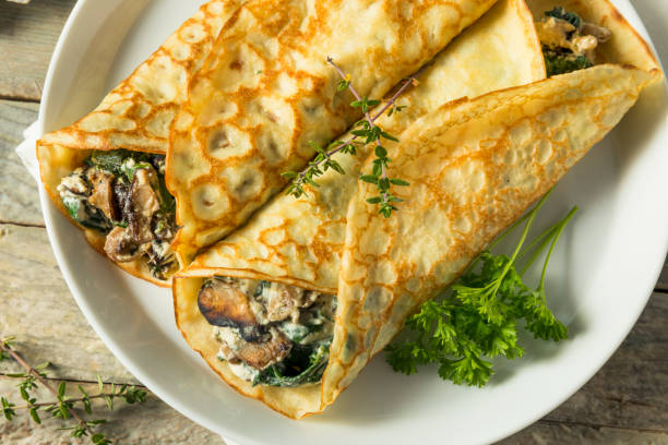 istock Savory Homemade Mushroom and Spinach Crepes 873075868