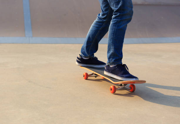 istock skateboarder legs skateboarding on skatepark ramp 873078910