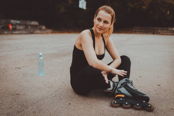istock Woman relaxing after roller skating 873082356