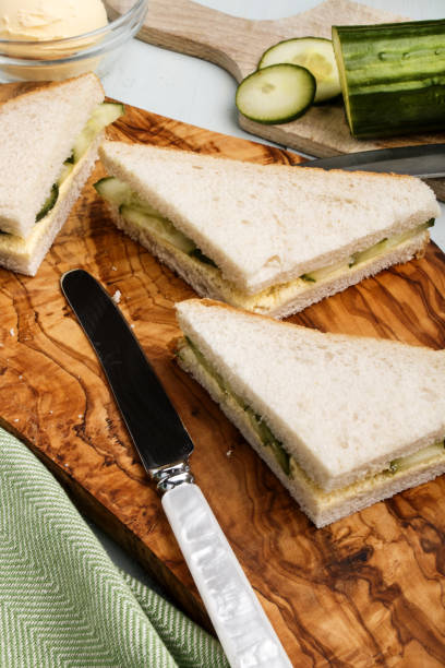 istock fresh made cucumber sandwich on a wooden board 873091408