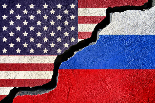 istock Concept american and Rusia flag on cracked background 873092054