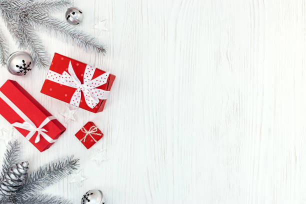 istock christmas gift boxes on wooden white table 873098114