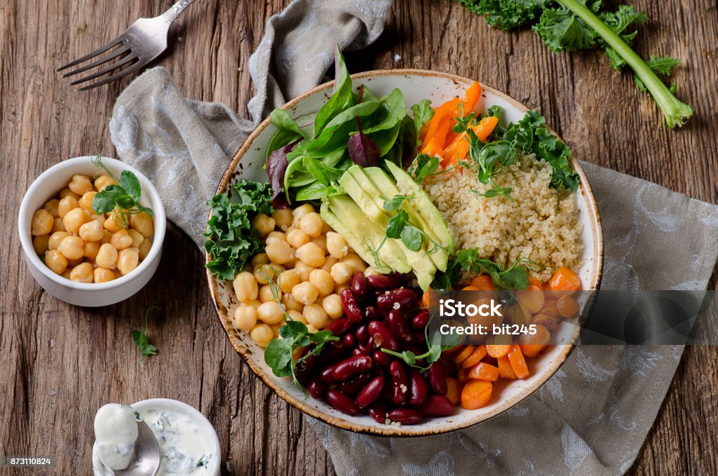 Vegetables Vegetarian Buddha bowl with quinoa and chickpea. Vegetarian and vegan food concept. Healthy eating Bowl Stock Photo