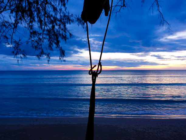 istock Shadow rope of crib on sunset beach sea 873125606