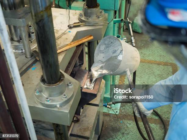 Operator Pouring Aluminum Molten In To High Precision Casting Mold Stock Photo - Download Image Now