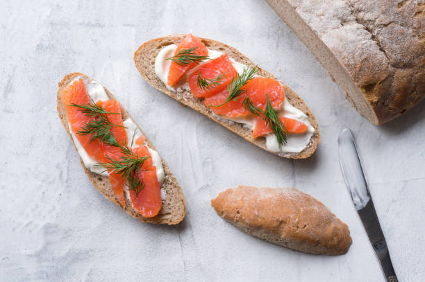 istock Homemade toast with smoked salmon. Top view. 873133858