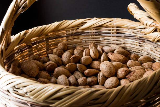istock Fresh Organic Raw Almonds with Shell in Basket. 873134602