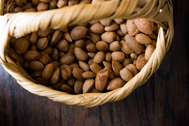istock Fresh Organic Raw Almonds with Shell in Basket. 873137502
