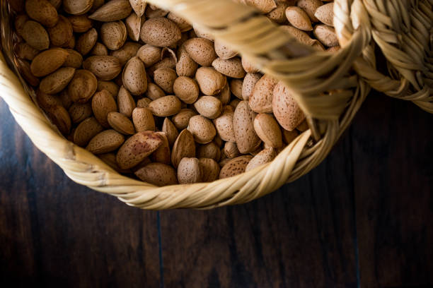 istock Fresh Organic Raw Almonds with Shell in Basket. 873137696