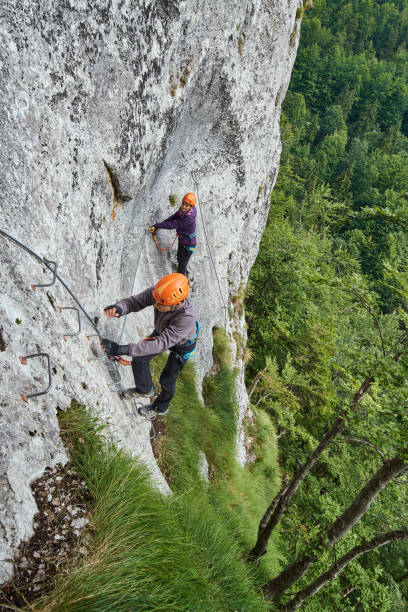 istock Climbing on via ferrata 873140684