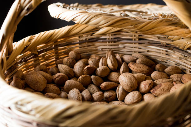 istock Fresh Organic Raw Almonds with Shell in Basket. 873140910
