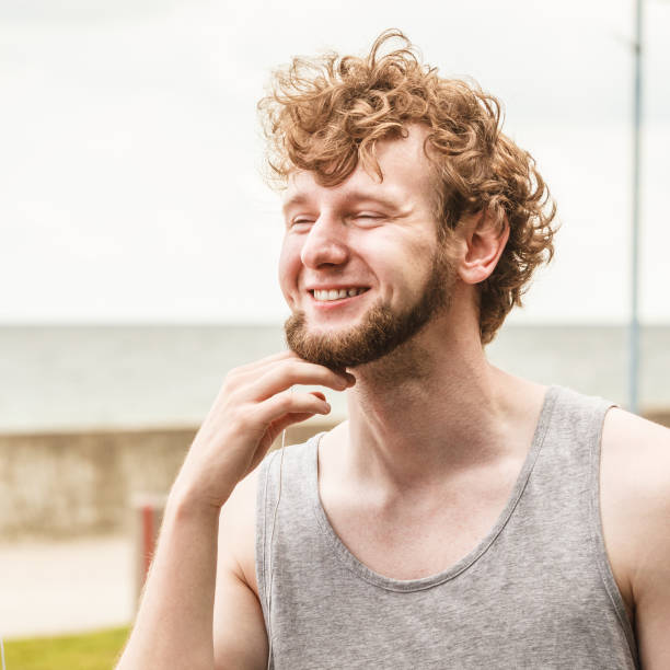 istock Man relaxing by sea ocean outdoor. 873150134