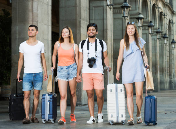 istock People taking promenade with suitcases 873152726