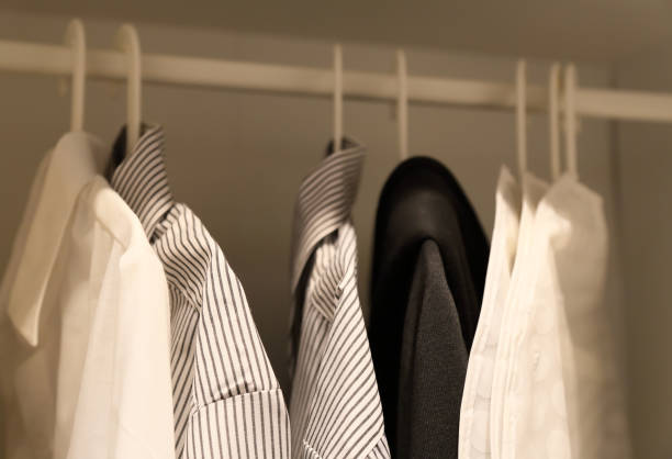 man's shirts in cabinet stock photo
