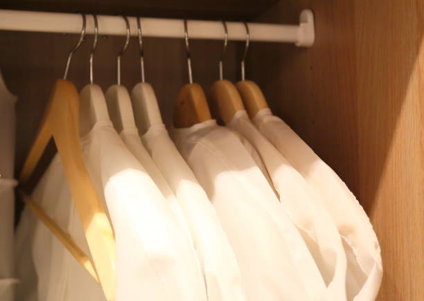 A few pieces of men's shirts in cabinet stock photo