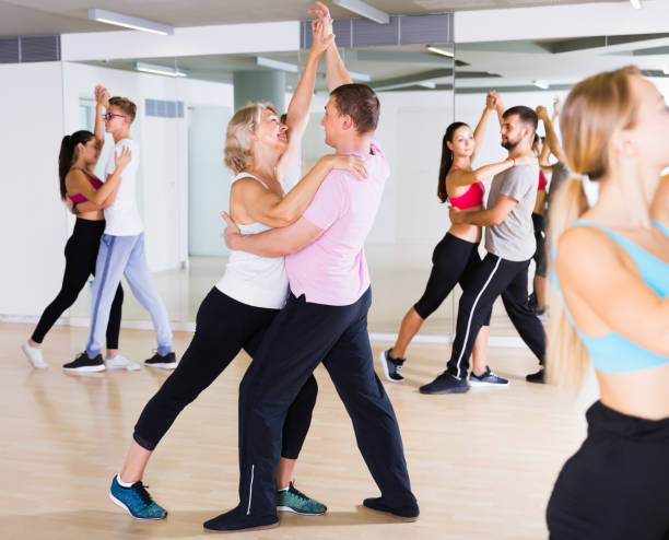 istock Laughing dancing pair dance waltz  together 873153984