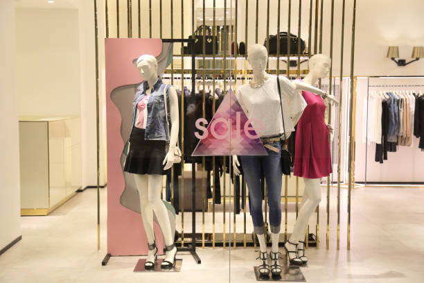 sale sign and showcase model at shop stock photo