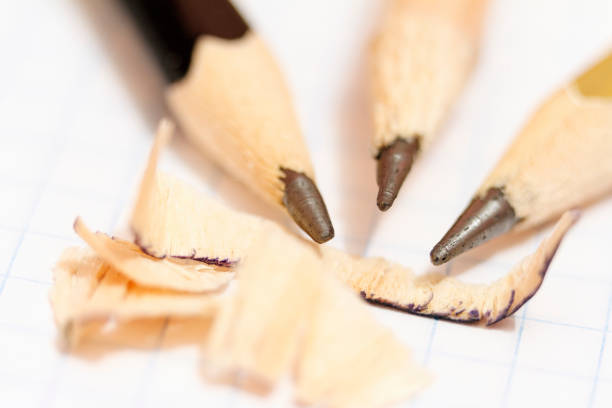 istock Pointed pencils on a background of a sheet of a notebook close-up 873160636