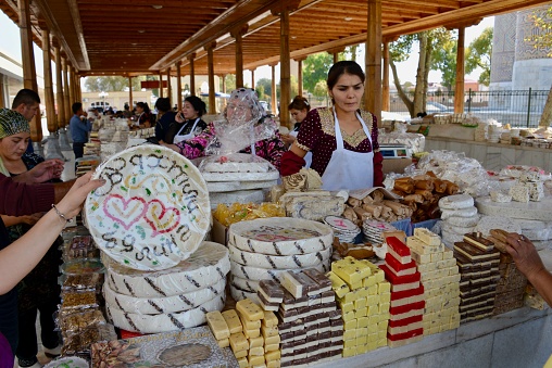 Samarkand, Uzbekistan - October 13, 2017: traditional fudges and wedding cakes for sale at the Siab Dekhkhan Bazaar, in central Samarkand.